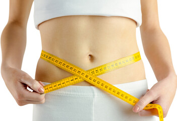 Midsection of fit woman measuring her waist