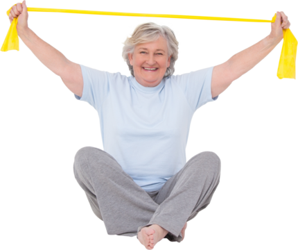 Senior woman using resistance band - Powered by Adobe