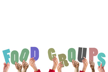 Hands holding up food groups