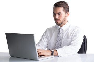 Cheerful businessman using laptop at desk 