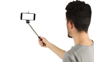 Casual man using a selfie stick
