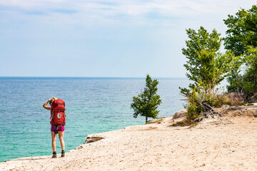 Woman hiking Pictured Rocks National Lakeshore