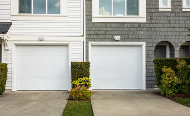Double garage with short driveway. Wide Garage Door with concrete driveway in front in a perfect neighbourhood