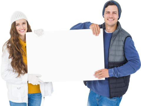 Happy couple in winter clothes holding blank poster - Powered by Adobe