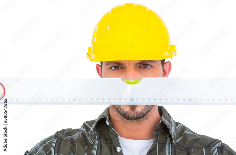 Wall mural Handyman looking at spirit level