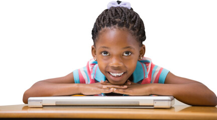 Smiling pupil sitting at her desk 