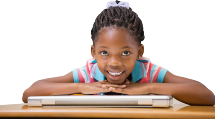 Smiling pupil sitting at her desk 