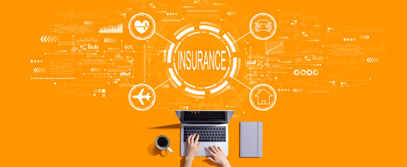 Insurance concept with person working with a laptop