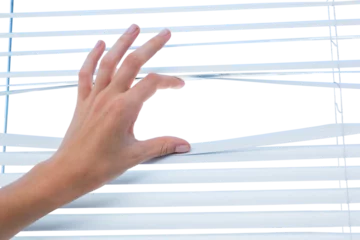 Fotobehang Hand opening venetian blind © vectorfusionart