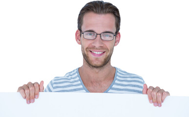 Portrait of smiling man holding billboard