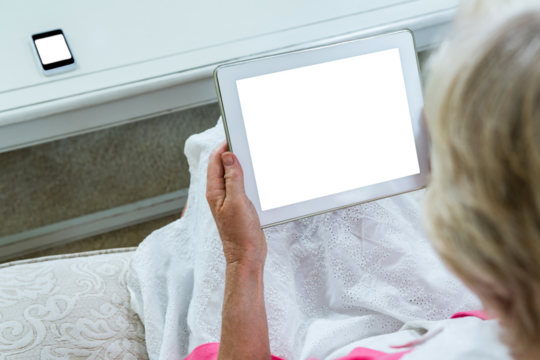 Senior woman looking at digital tablet