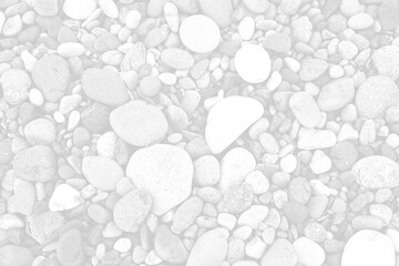 Many different pebbles as background, top view. Black and white effect