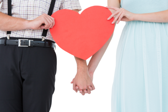 Hipster couple holding heart card