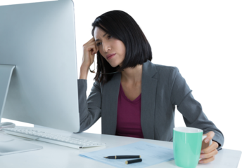 Tired businesswoman looking at computer