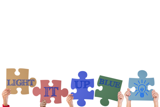 Hands holding up jigsaw pieces