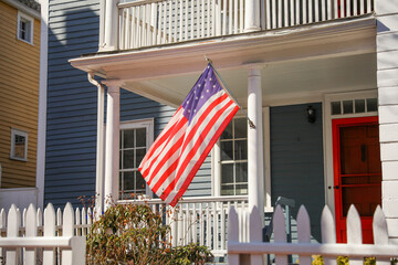 The US flag on a pole is a symbol of patriotism and unity, representing the country's values,...