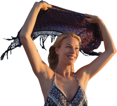 Smiling woman holding scarf in the air  - Powered by Adobe