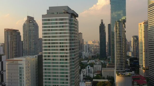 sunset time flight over bangkok city modern downtown aerial panorama 4k thailand
