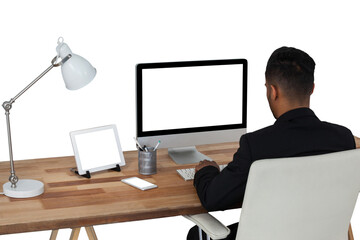 Rear view of businessman working over computer