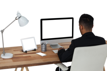 Rear view of businessman working over computer