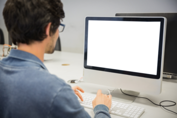 over the shoulder view of of serious casual man working at computer desk
