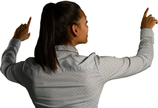 Rear view of woman touching invisible screen - Powered by Adobe