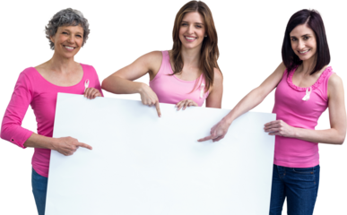Women in pink outfits holding board for breast cancer awareness