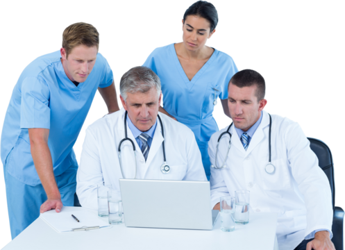 Team of doctors using laptop at desk