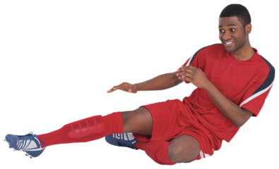 Football player in red kicking