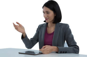 Businesswoman gesturing at desk