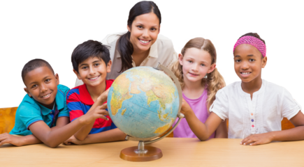 Cute pupils and teacher looking at globe in library 