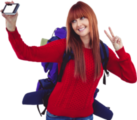 Smiling hipster woman with a travel bag taking selfie