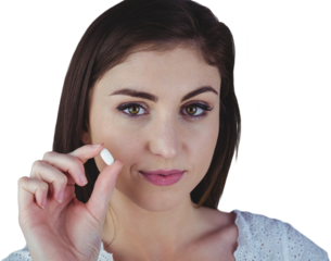 Portrait of woman showing white pill