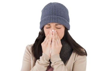 Sick brunette blowing her nose