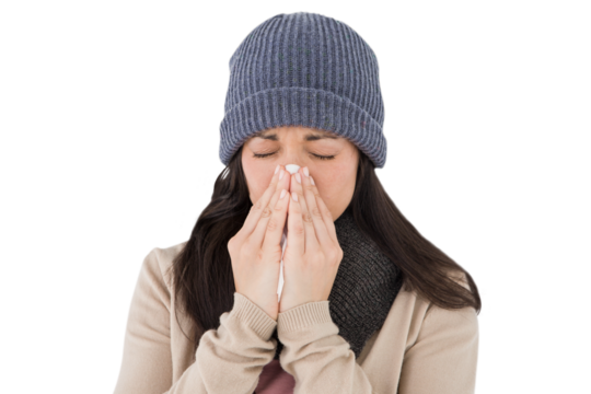 Sick brunette blowing her nose