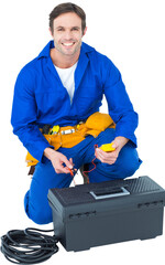 Happy electrician holding multimeter