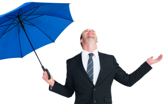 Happy businessman holding blue umbrella and looking up