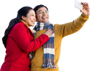 Older asian couple on balcony taking selfie