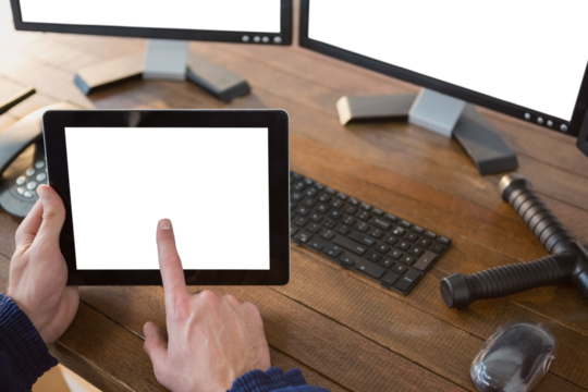 Security officer using digital tablet at desk