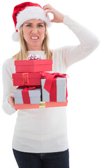Stressed blonde in santa hat holding gifts