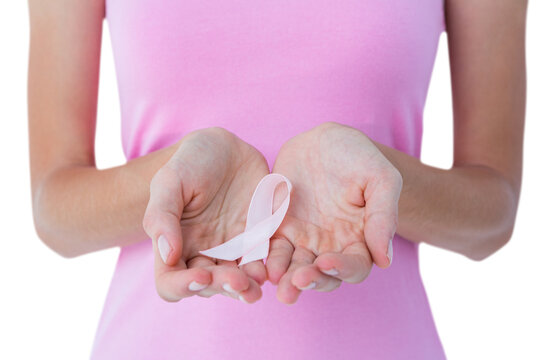 Woman holding pink ribbon for breast cancer awareness