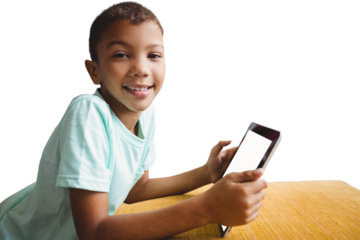 Portrait of boy holding digital tablet