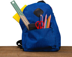 Bag with school supplies on wooden table