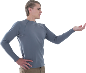 Businessman with hand on hip holding invisible product