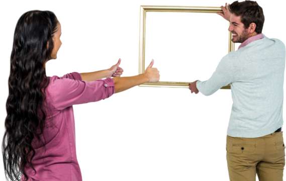 Smiling couple with picture frame