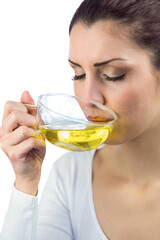 Peaceful woman drinking herbal tea