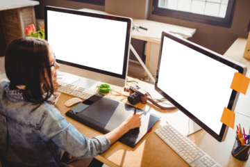 High angle view of graphic designer using graphics tablet