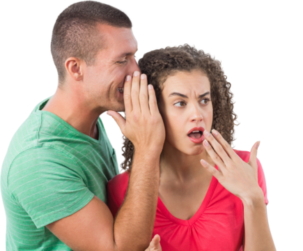 Businessman whispering secret into female colleague's ear