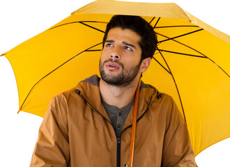 Thoughtful man with yellow umbrella