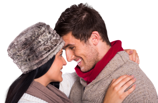 Young couple smiling and hugging